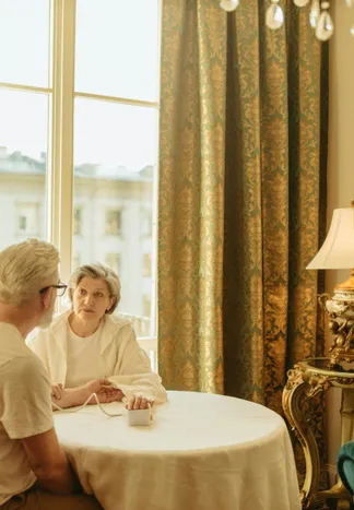 Elderly couple sitting together in a quiet moment of connection