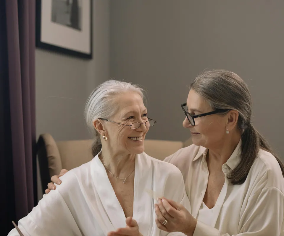 Caregiver sharing a warm moment with elderly client