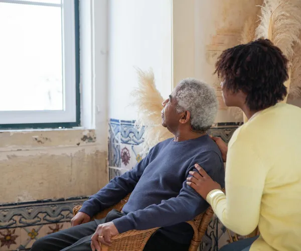Warm companionship between elderly man and caregiver